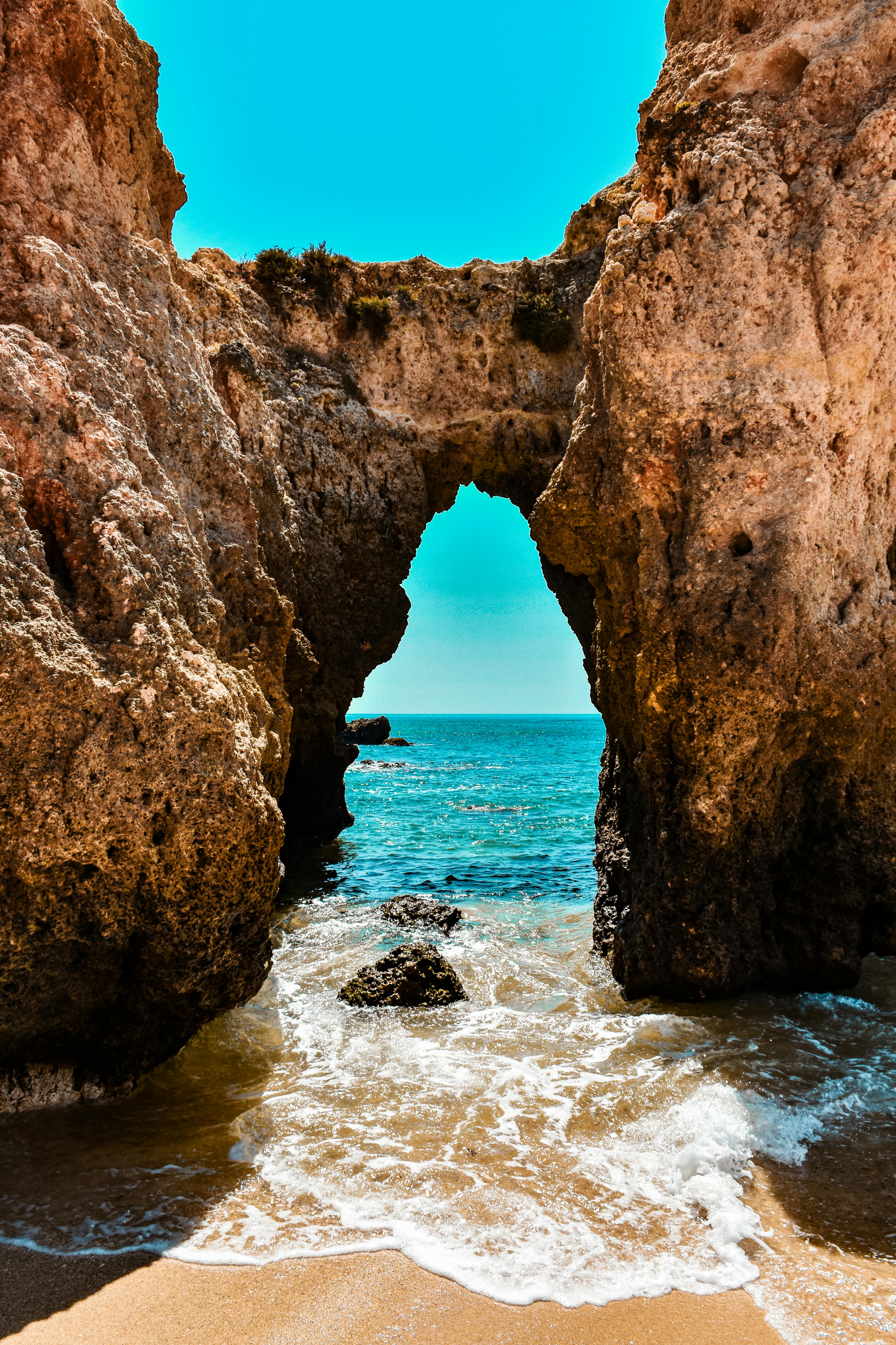 Waves lapping on sand and rocks